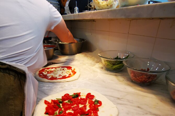 Authentic Pizza Making Class in Naples with Appetizers and Drink - Stretching the dough like a pizzaiolo