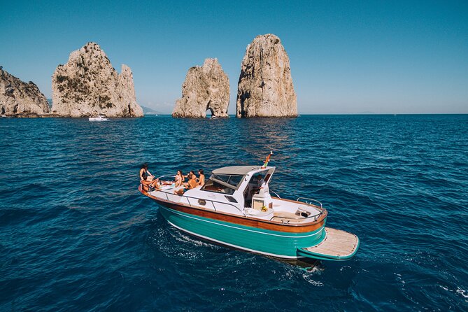 Capri Island Small Group Boat Tour from Naples with Light Lunch - The boat route around Capri: grottos first, then the big-name views