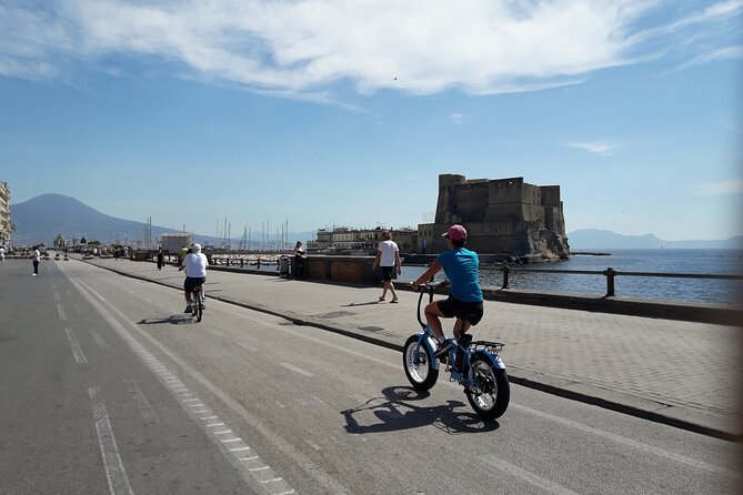 Naples electric bike tour Partenope - The Sebeto river monument and Palazzo Donn’Anna on the way toward Posillipo
