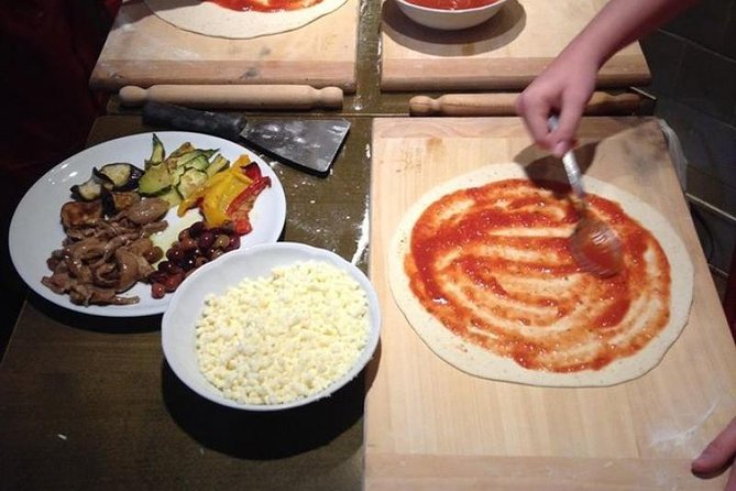 Naples Pizza-Making: From Dough to Dessert & Wine at Pizzeria - Topping a Margherita the Neapolitan way, then baking in a wood-fired oven