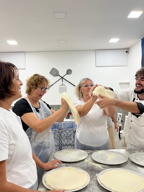 Pizza-Making Workshop by night with glass of wine - Shaping and Topping Your Margherita Like It Matters