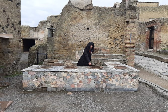 Private Walking Tour through the Historical City of Herculaneum - Casa dei Cervi: deer, panoramic views, and polychrome marble