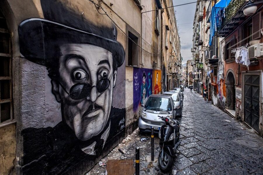 Street art tour of the Spanish Quarters & Maradona idol - Entering the Spanish Quarters, where murals act like memory